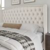 product-fancy-5530f119-4e89-4aeb-93a4-717a96c2e2e6 Handcrafted Velvet Bed Frame Featuring a Wingback Headboard, Adorned with Button Tufting And Nailhead Accents, Supported by Wooden Slats.
