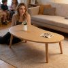 product-fancy-66b2c5b0-7146-4c92-af7a-9a70959a6e13 Natural Wood Grain Oval Coffee Table, Irregular Solid Wood Top Shows Unique Beauty. Slim Legs Create Lightweight Visual. Cozy Companion for Living Room Reading Nook. Holds Vase And Magazines Displaying Lifestyle. Modern Minimalist Home Core Piece
