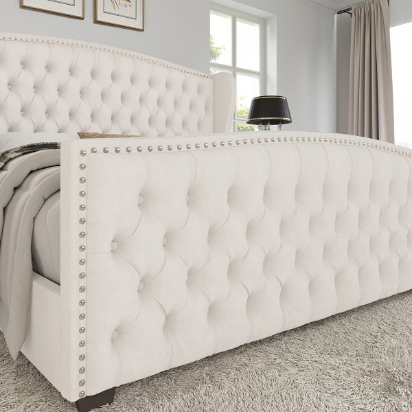 product-fancy-6c38fd3c-a04c-400b-ab02-f2f024f78bfe Handcrafted Velvet Bed Frame Featuring a Wingback Headboard, Adorned with Button Tufting And Nailhead Accents, Supported by Wooden Slats.