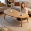 product-fancy-85a3ed02-8d9d-4b38-9298-5152626b7130 Natural Wood Grain Oval Coffee Table, Irregular Solid Wood Top Shows Unique Beauty. Slim Legs Create Lightweight Visual. Cozy Companion for Living Room Reading Nook. Holds Vase And Magazines Displaying Lifestyle. Modern Minimalist Home Core Piece
