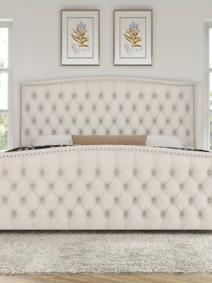Handcrafted Velvet Bed Frame Featuring a Wingback Headboard, Adorned with Button Tufting And Nailhead Accents, Supported by Wooden Slats.