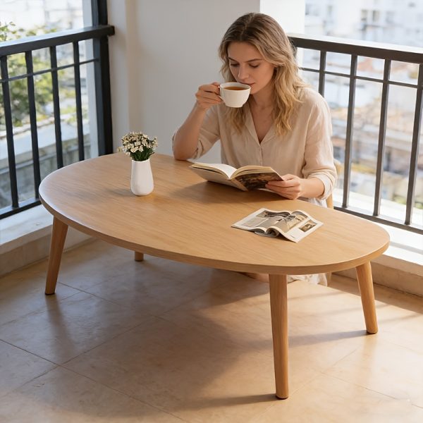 product-fancy-f476bffd-a962-4fbe-a12f-ed7b942b9690 Natural Wood Grain Oval Coffee Table, Irregular Solid Wood Top Shows Unique Beauty. Slim Legs Create Lightweight Visual. Cozy Companion for Living Room Reading Nook. Holds Vase And Magazines Displaying Lifestyle. Modern Minimalist Home Core Piece